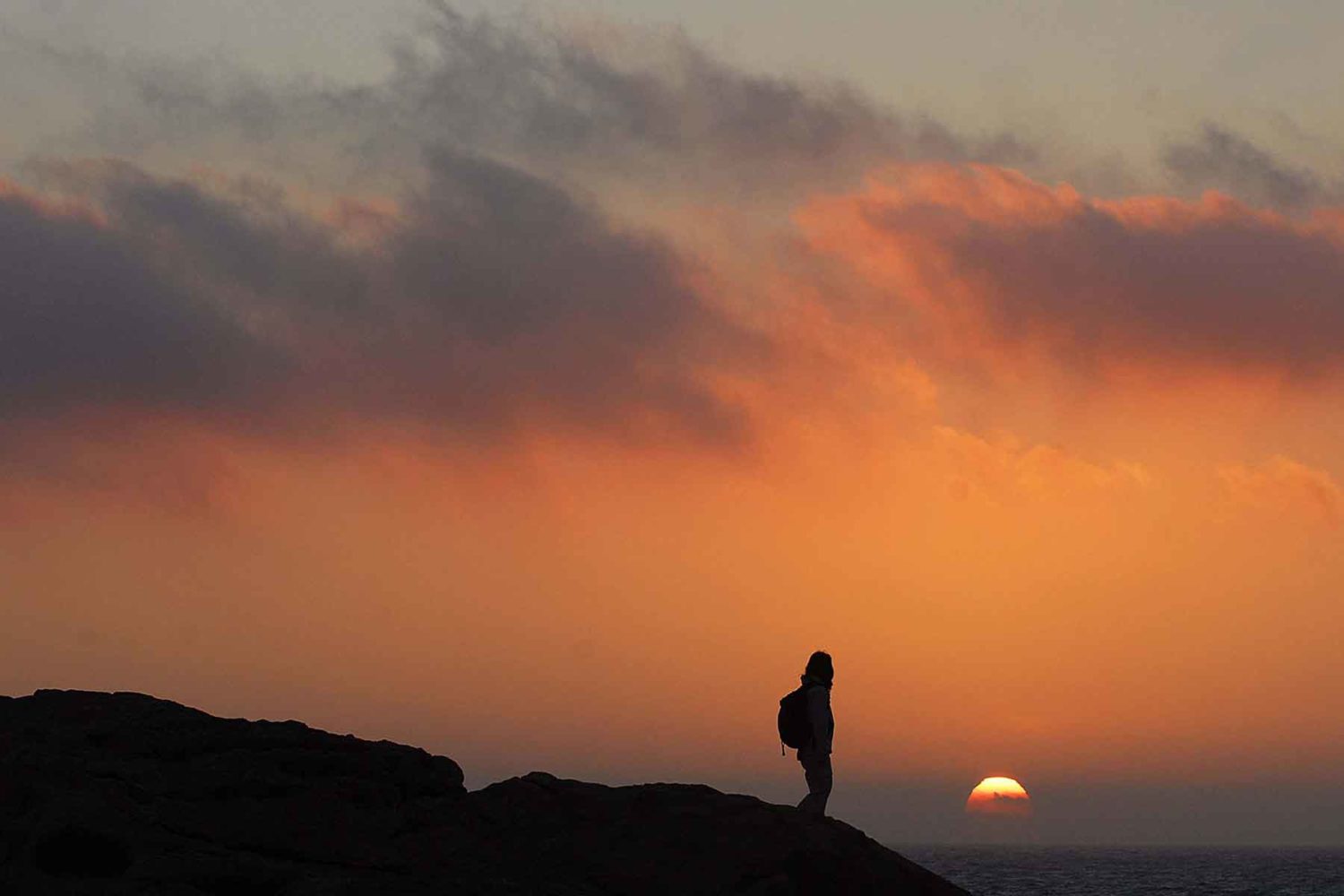 hiker watching sunset-walking holidays in Malta