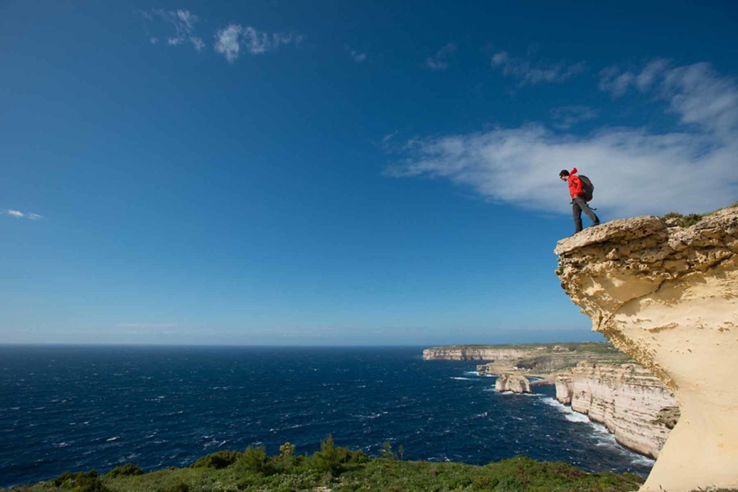 hiker on the cliff-walking holidays in Malta