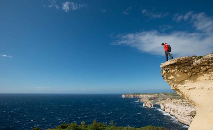 hiker on the cliff-walking holidays in Malta